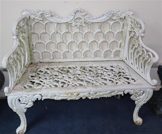 A white painted cast iron bench